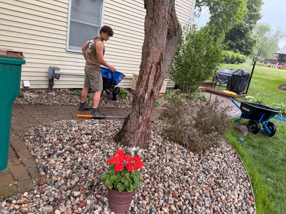 Gallery photos for Full Garden Bed Redesign with River Rock and Metal Edging in Portage: Image #3