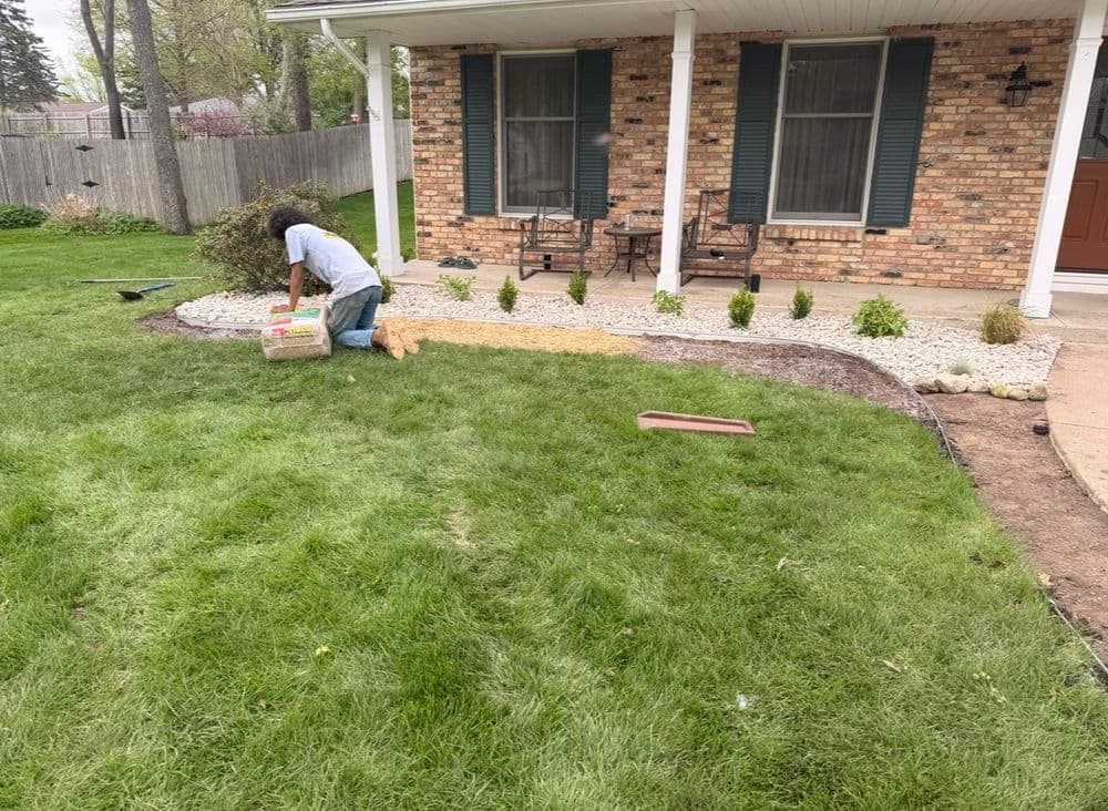 Gallery photos for Full Garden Bed Redesign with River Rock and Metal Edging in Portage: Image #1