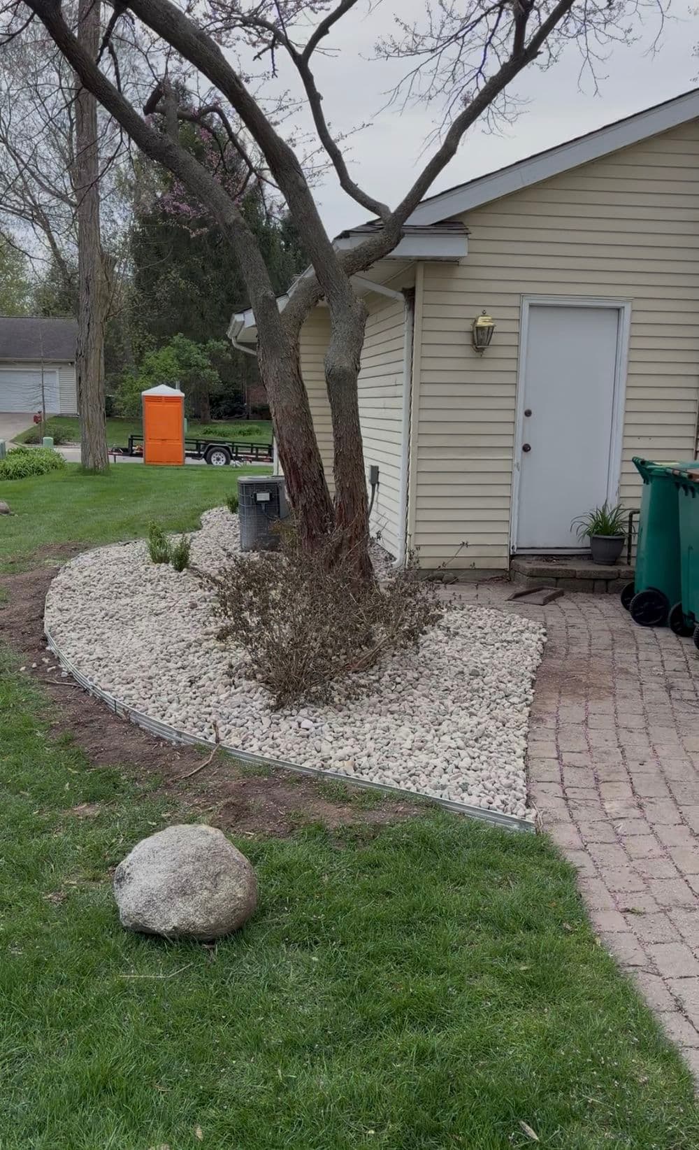 Gallery photos for Full Garden Bed Redesign with River Rock and Metal Edging in Portage: Image #4