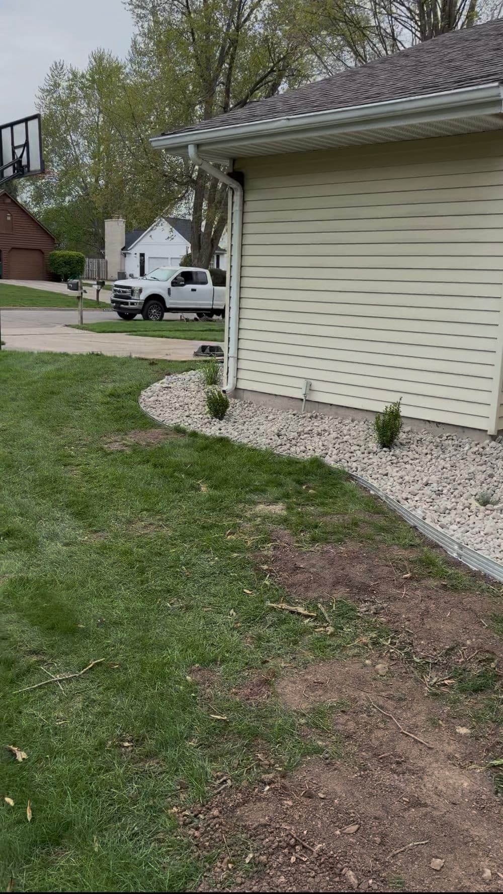 Gallery photos for Full Garden Bed Redesign with River Rock and Metal Edging in Portage: Image #5
