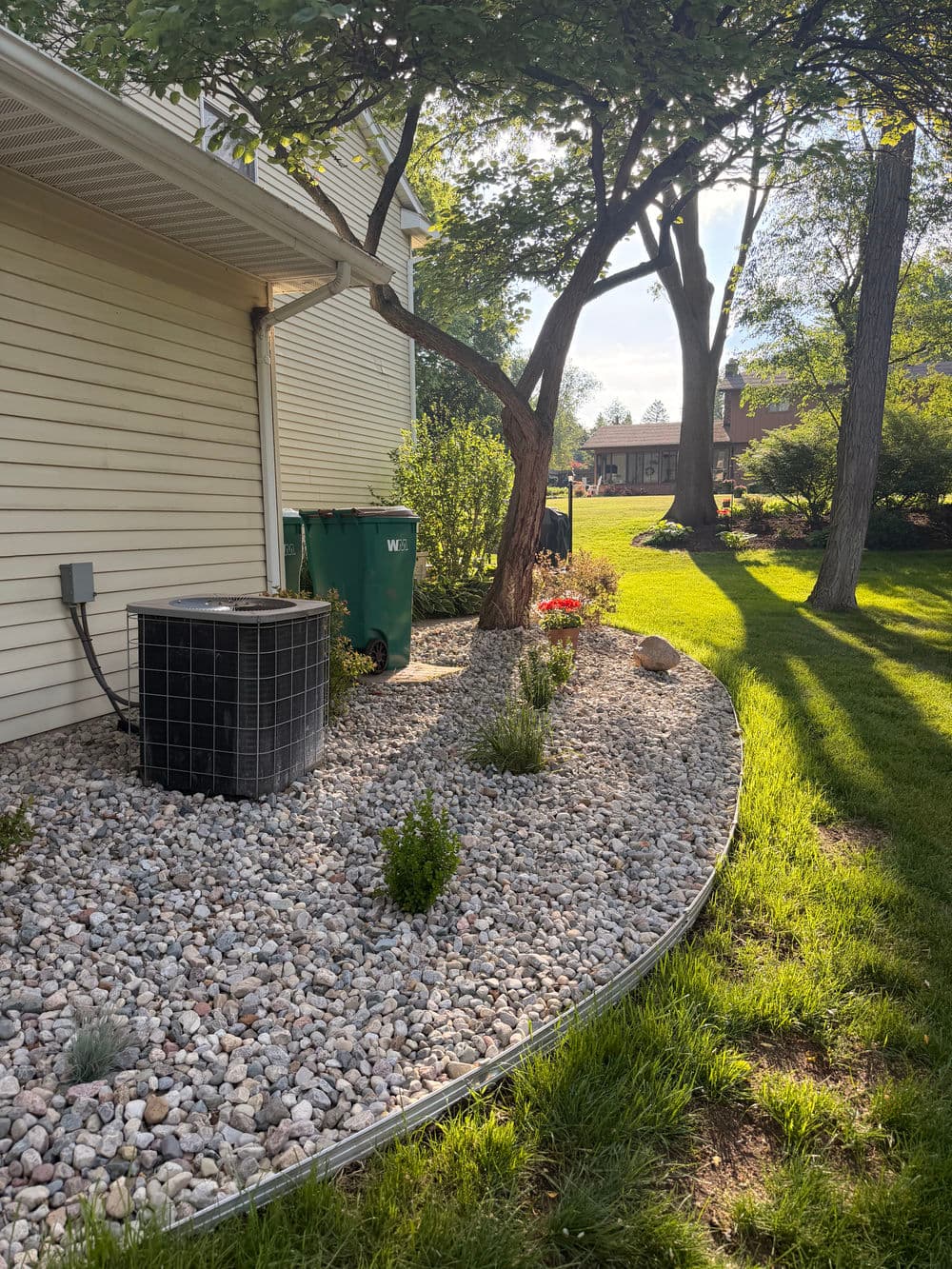 Gallery photos for Full Garden Bed Redesign with River Rock and Metal Edging in Portage: Image #2
